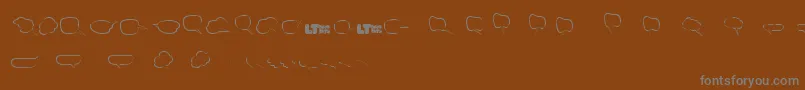 Шрифт Freakycommentballoonslt – серые шрифты на коричневом фоне