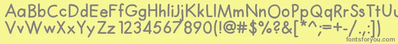 フォントClaphappy – 黄色の背景に灰色の文字