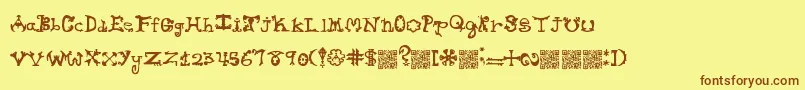 Hieroglyphlicks Font – Brown Fonts on Yellow Background