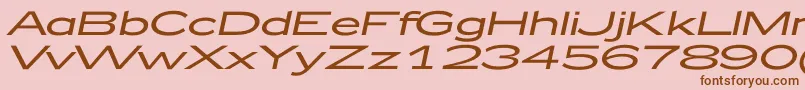 Fonte Zeppelin52Italic – fontes marrons em um fundo rosa