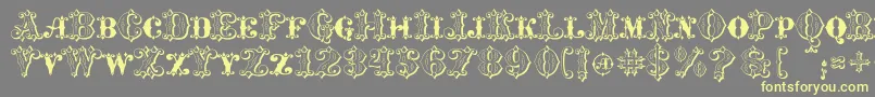 MavericksLuckKqs Font – Yellow Fonts on Gray Background