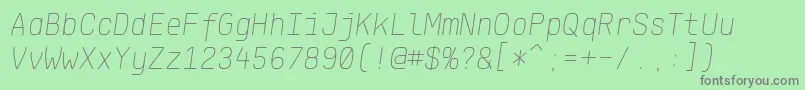 Fonte KlartextMonoThinItalic – fontes cinzas em um fundo verde