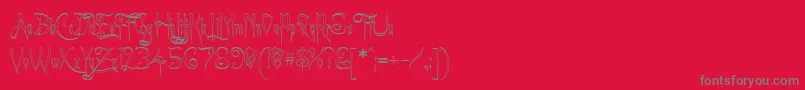フォントACharmingFontOutline – 赤い背景に灰色の文字