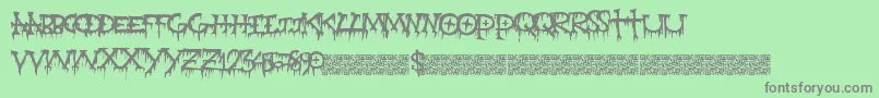 Gravepain Font – Gray Fonts on Green Background