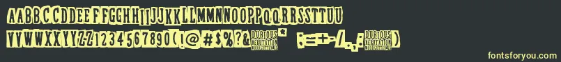 フォントDubiousReputation – 黒い背景に黄色の文字
