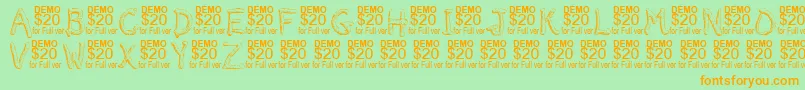 Smeltdemoフォントについての詳細 フォントSmeltdemo – オレンジの文字が緑の背景にあります。