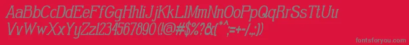 GabrielSerifCondensedItalic-fontti – harmaat kirjasimet punaisella taustalla