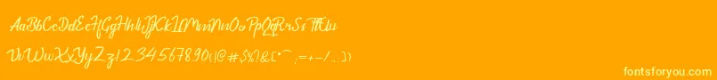 フォントDekadePersonalUse – オレンジの背景に黄色の文字