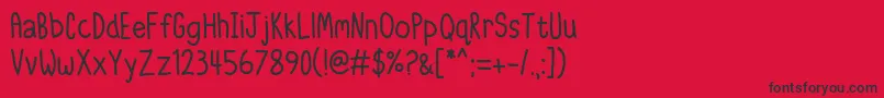 IttyBittyNotebook-Schriftart – Schwarze Schriften auf rotem Hintergrund