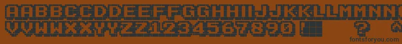 KarmaticArcade Font – Black Fonts on Brown Background
