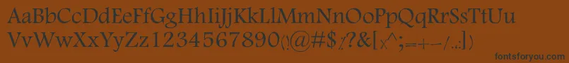 MotkenKTabassom-Schriftart – Schwarze Schriften auf braunem Hintergrund