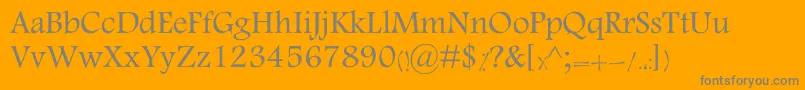 MotkenKTabassom-Schriftart – Graue Schriften auf orangefarbenem Hintergrund