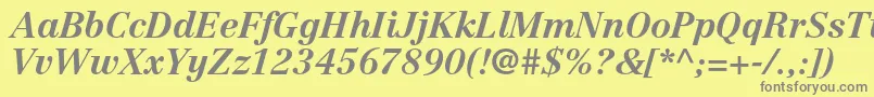 CentennialltstdBolditalic-fontti – harmaat kirjasimet keltaisella taustalla