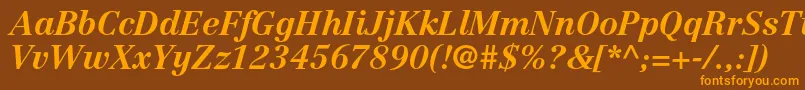 フォントCentennialltstdBolditalic – オレンジ色の文字が茶色の背景にあります。