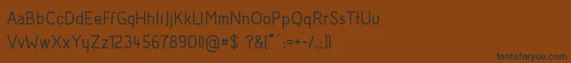 フォントAcidMedium – 黒い文字が茶色の背景にあります