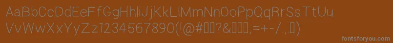 フォントRegosel – 茶色の背景に灰色の文字