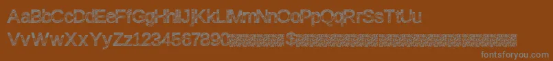 Discofresa-fontti – harmaat kirjasimet ruskealla taustalla