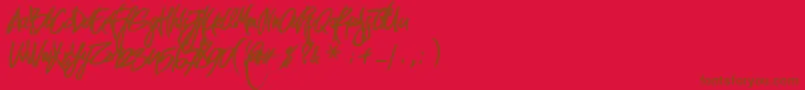 PirmokasDemo-Schriftart – Braune Schriften auf rotem Hintergrund