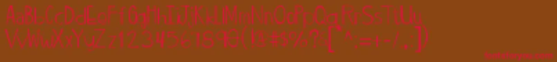 Twiggypopscratch-Schriftart – Rote Schriften auf braunem Hintergrund
