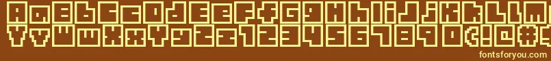 TinyBoxbita10 Font – Yellow Fonts on Brown Background