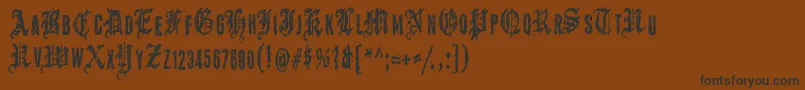 フォントGrymmoire – 黒い文字が茶色の背景にあります