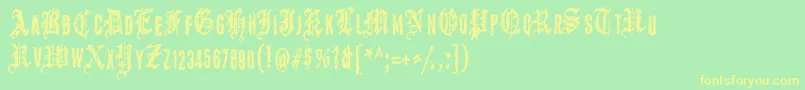 フォントGrymmoire – 黄色の文字が緑の背景にあります