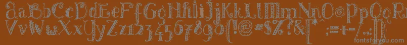Pattd-fontti – harmaat kirjasimet ruskealla taustalla