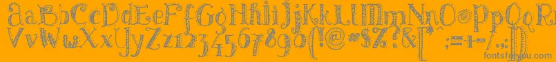 Pattd-Schriftart – Graue Schriften auf orangefarbenem Hintergrund
