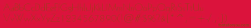 Geometric231LightBt-Schriftart – Braune Schriften auf rotem Hintergrund