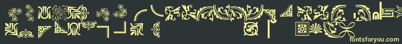 フォントBordersornament5 – 黒い背景に黄色の文字