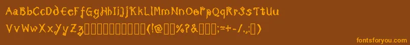 Fonte TricktreatsleepBoldRegular – fontes laranjas em um fundo marrom