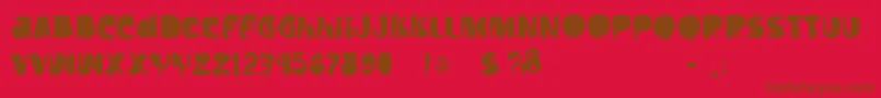 フォントVtkstilt – 赤い背景に茶色の文字