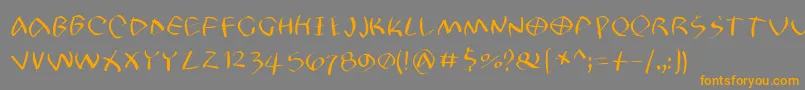 Petrifree Font – Orange Fonts on Gray Background