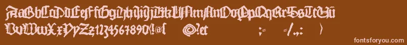 Monkswriting-fontti – vaaleanpunaiset fontit ruskealla taustalla