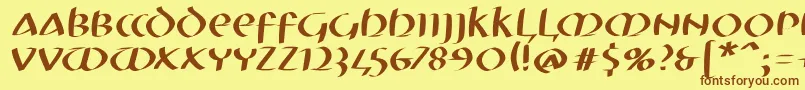 Шрифт Mkuncialeobliquefs – коричневые шрифты на жёлтом фоне