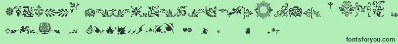 Fleurons Font – Black Fonts on Green Background