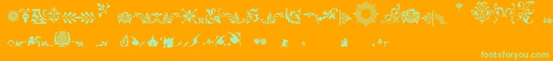 Fleurons-Schriftart – Grüne Schriften auf orangefarbenem Hintergrund