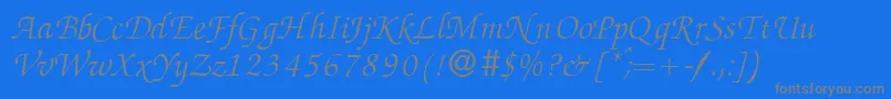 ZabriskiescriptItalic-fontti – harmaat kirjasimet sinisellä taustalla