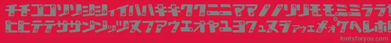 KankanaK-Schriftart – Graue Schriften auf rotem Hintergrund