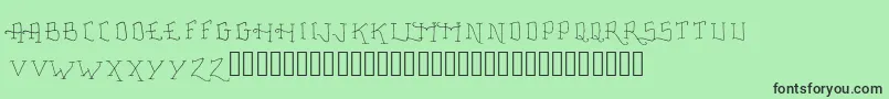 Fonte FancyTattooScript – fontes pretas em um fundo verde