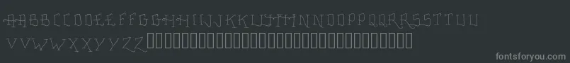 Więcej informacji o czcionce FancyTattooScript Czcionka FancyTattooScript – szare czcionki na czarnym tle