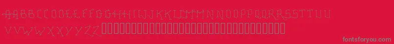 Fonte FancyTattooScript – fontes cinzas em um fundo vermelho