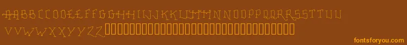 Шрифт FancyTattooScript – оранжевые шрифты на коричневом фоне