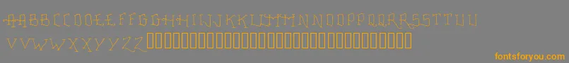 Czcionka FancyTattooScript – pomarańczowe czcionki na szarym tle