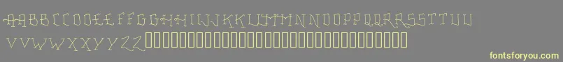 FancyTattooScript Font – Yellow Fonts on Gray Background