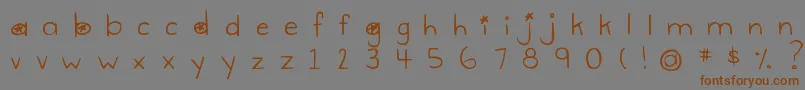 フォントDjbGimmeSpace – 茶色の文字が灰色の背景にあります。