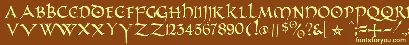 PrUncialAlternateCapitals-fontti – keltaiset fontit ruskealla taustalla