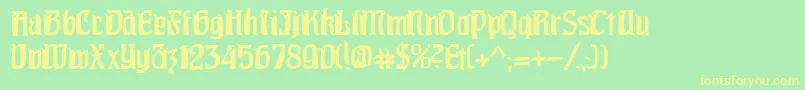 フォントPittoresk – 黄色の文字が緑の背景にあります