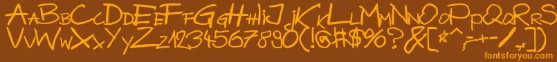 フォントBazgrolyB – オレンジ色の文字が茶色の背景にあります。