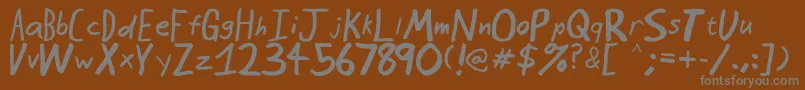 SeattleAvenue-fontti – harmaat kirjasimet ruskealla taustalla